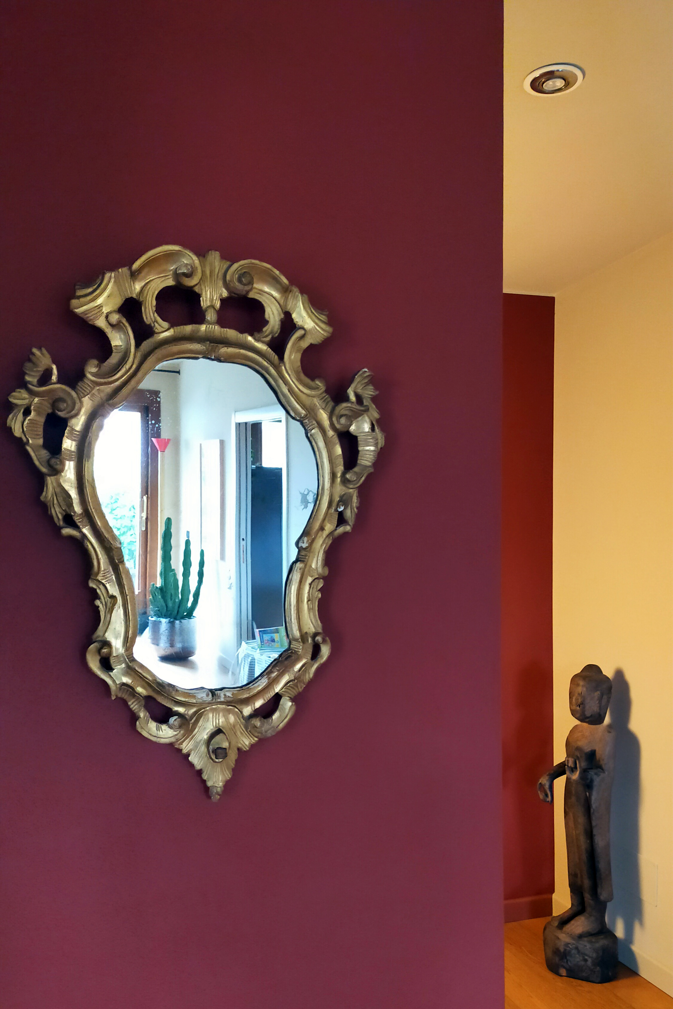 Attico Brescia specchio antico scultura orientale